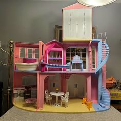 a doll house is shown with furniture and accessories