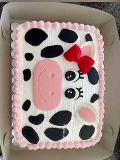 a decorated cake in the shape of a cow