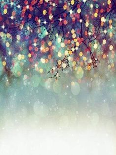 an abstract christmas tree with lights in the background and snow flakes on the branches