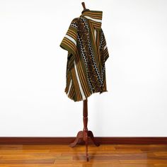 This remarkable unisex poncho, crafted from llama wool yarn, is brand new! It's featherlight, exceptionally soft, and warm to the touch - no itching here! One Size: 43" W x 36" H / 110 cm W x 92 cm H incl. fringe Material: Llama Wool Colour/pattern could vary slightly from the photo. Weight of each item: 950 g Care: Hand Wash Use Mild Detergent Do not Bleach Cheap Multicolor Fall Poncho, Affordable Multicolor Fall Poncho, Cheap Multicolor Winter Poncho, Handwoven Alpaca Poncho For Fall, Fall Handwoven Alpaca Poncho, Traditional Multicolor Woven Poncho, Multicolor Handwoven Folk Poncho, Luxury Multicolor Poncho, Cozy Long Sleeve Alpaca Poncho