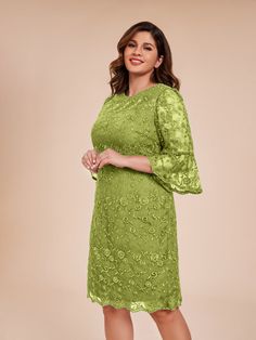 a woman wearing a green lace dress