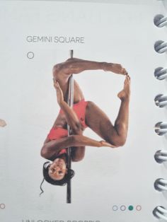 a spiral bound notebook with an image of a woman doing pole dancing on the cover