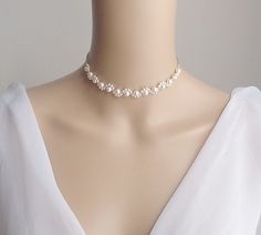 This is an original design by © Isabella Bridal. Details - Swarovski pearls - Lobster clasp closure with 2 inches extender chain. Feel free to contact me with any questions! Custom orders welcome. All orders will ship within 48 hours, except for weekends ALL ORDERS ARE SHIPPED VIA USPS FIRST CLASS WITH TRACKING. Handmade in the USA This item is Made-to-Order and therefore is a final sale. Delicate Beaded Pearl Necklace For Wedding, Adjustable Pearl Chain Necklace For Wedding, White Bridal Pearl Choker Necklace, Pearl Choker Bridal Necklace For Wedding, Delicate Pearl Necklace For Wedding, Adjustable Pearl Chain Bridal Necklace For Weddings, Pearl Bridal Choker For Wedding, Bridal Pearl Choker For Wedding, Delicate White Necklace For Wedding