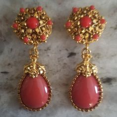 This Is Authentic Jose & Maria Barrera Earrings. These Lovely Haute Couture Earrings Are Done In A 24k Yellow Gold Plate. Gorgeous Coral Colored Stones Designed Earrings Are Sprinkled With Swarovski Crystals In Coral And 24k Gold-Plated Throughout The Earrings. The Backs Are Marked, "Barrera." Handmade In The U.S.A. These Are Brand New And Have Never Been Worn. This Is From Neiman Marcus And Is Not The Cheap Barrera From Avon. I Purchased These From Neiman Marcus Many Years Ago!! These Measure 2 Elegant Red Bridal Earrings, Red Clip-on Earrings For Wedding, Elegant Orange Clip-on Earrings, Elegant Coral Earrings For Formal Occasion, Elegant Orange Chandelier Earrings Gift, Elegant Orange Chandelier Earrings For Gift, Red Teardrop Chandelier Earrings For Formal Occasions, Orange Teardrop Jewelry For Formal Occasions, Ornate Clip-on Earrings For Evening