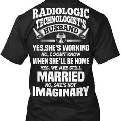 the back of a black t - shirt that says massage therapy husband yes she's working