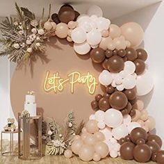 balloons and confetti decorate the backdrop for a let's party