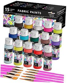 12 different colors of fabric paint in a display box with markers and pencils on the side