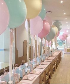 an image of a party with balloons and place settings on the table for guests to sit at