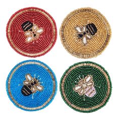 four round beaded coasters with bees and flowers on each one in different colors