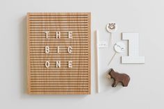 a wooden board with the words'the big one'written on it next to other items