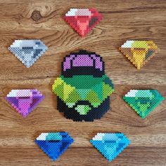 the pixel art is made out of plastic and has different colored diamond shapes on it