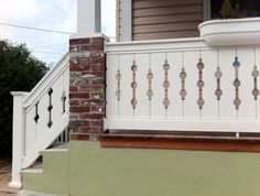 a white railing on the outside of a house