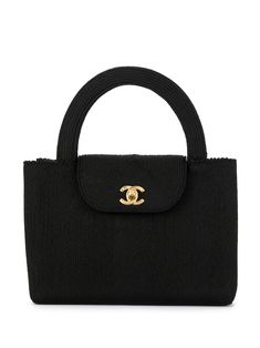 Abdicating elegance is an impossible and refused task for the most sophisticated maison in France, gracefully combining casualty with sophistication, as seen in this black CC logos tote. Featuring a braided style, round top handles, a foldover top, an internal zipped pocket, an internal logo stamp, gold-tone hardware and a CC turn-lock fastening. Please note that pre-owned items are not new and therefore might have minor imperfections. This item comes with original Chanel authenticity card. Quilted Handbags, Shopping Chanel, Logo Stamp, Vintage Bags, Black Handbags, Body Bag, Chanel Classic Flap, Chanel Bag, Chanel Classic