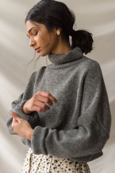 Our classic boucle knit jumper, with a roll neck and made from a 60% wool mix; perfect for layering in the chillier months. Features a flecked detail to the knit, an unbalanced hemline, dropped shoulder sleeves and a small Olive tab stitched to one side of the seam. The boucle is boxy in cut and is made for a relaxed and slouchy fit. Woman Sweater, Fall Attire, Creative Photoshoot Ideas, Maxi Skirt Outfits, Buy List, Turtle Neck Jumper, Clothes Diy