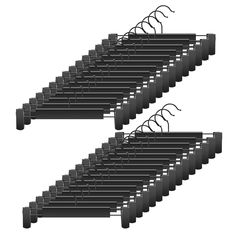 a row of black clothes hangers next to each other on a white background with clippings