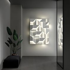 a room with some plants in it and lights on the wall