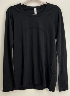 NWT Size 14 Lululemon Swiftly Tech Long Sleeve 2.0 BLK Black. Condition is New with tags. Shipped with USPS Ground Advantage. Lululemon Swiftly Tech Long Sleeve, Lululemon Swiftly Tech, Lemon Top, Active Wear Tops, Black Long Sleeve, Shirt Sleeves, Black Shirt, Active Wear, Women Accessories