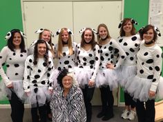 a group of girls dressed up in dalmatian costumes