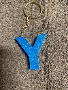 a keychain shaped like the letter y