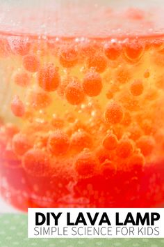 an orange and red liquid in a glass with the words diy lava lamp simple science for kids