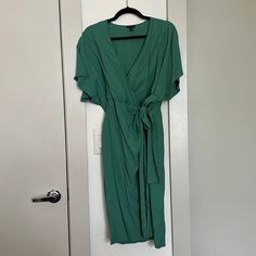 New Without Tags, Never Worn Wrap Dress With Button And Tie Flutter Sleeves Length: 42.25” Green Wrap Dress For Work, Green Tie Waist Dresses For Brunch, Chic Green Wrap Dress With Short Sleeves, Chic Green Wrap Dress For Work, Green Midi Length Wrap Dress For Work, Green Tie Waist Midi Dress For Work, Green Midi Dress With Tie Waist For Work, Chic Green Midi Dress With Tie Waist, Casual Green Midi Wrap Dress