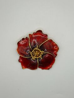 New old stock. This is a striking vintage ALANA STEWART SIGNED large gold tone & enamel red poppy flower brooch pin, pendant. The dimensional and substantial brooch displays a colorful vibrant red poppy. It measures approx. 2 3/4" x 2 3/4". On the back it is marked, Alana Stewart copyright symbol. It has a roll over clasp. The item can be worn as a brooch or a pendant necklace. The chain is not included. The condition of this item is excellent. Never worn. In original box. This would be a great addition to any vintage costume jewelry collection. Please stop by our shop at https://www.etsy.com/shop/Vintageglamjewerly Red Enamel Brooch Pin, Red Enamel Brooch, Vintage Red Enamel Brooches, Red Enamel Vintage Brooch, Collectible Gold Flower Enamel Pin, Alana Stewart, Brooch Display, Red Poppy Flower, Copyright Symbol