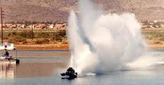 a boat is spraying water on the lake