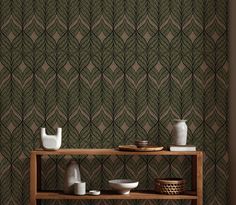 a shelf with vases and bowls on it in front of a wallpapered background