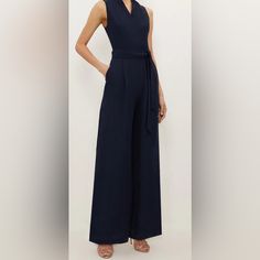 Brand New! Very Nice And Comfortable Donna Karan Womens Sleeveless V Neck Belted Wide Leg Navy Jumpsuit Size 10 -Jumpsuit -Sleeveless -V Neck -Wide Leg -Sides Slits -Color: Navy Blue -Chest: 34 In -Waist: 30 In -Material: Polyester, Spandex -Size: 10 Condition Is New! With Tags. Please See The Pictures For Measurements And Details. Sleeveless Jumpsuits And Rompers For Formal Summer Events, Formal Sleeveless Jumpsuits And Rompers For Summer, Sleeveless Summer Formal Pantsuit, Sleeveless Summer Pantsuit For Formal Occasions, Sleeveless Pantsuit For Summer Formal Occasions, Sleeveless Formal Summer Pantsuit, Sleeveless Pantsuit For Formal Summer Events, Sleeveless Blue Pantsuit For Summer, Chic Blue Sleeveless Jumpsuits And Rompers