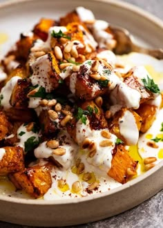 a white plate topped with food on top of a table