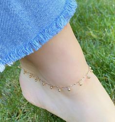 Solid 14K Gold Ball & Chain Anklet. The Perfect Body Jewelry, The Gold Balls Are Dangly Making It The Perfect Accessory. A Beautiful Gift To Give Yourself Or To Others. Jewelry Comes In A Cute Gift Box Ready To Present. -Jewelry Is New And Inspected For Quality Assurance. -Jewelry Is Crafted In Genuine High Quality 14K Gold. -We Do Not Sell Gold Plated. Product Detail: Metal: 14k yellow gold Weight: 2.8 grams Length: 9 inch + 1 inch Closure: spring clasp Style: dangling gold ball anklet -Fee Gold Anklets As Gift, 14k Gold Filled Anklets As A Gift, Gold 14k Gold Filled Anklets As Gift, Gold Anklet With Gold Beads As Gift, Elegant Gold Anklets With Round Beads, Dainty 14k Gold Anklets, Gold 14k Gold Filled Anklets For Gift, Elegant Gold Anklets In 14k Gold Filled, Traditional Gold Anklets With Adjustable Fit