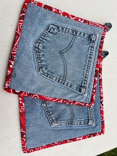 two pieces of blue jean fabric sitting on top of each other