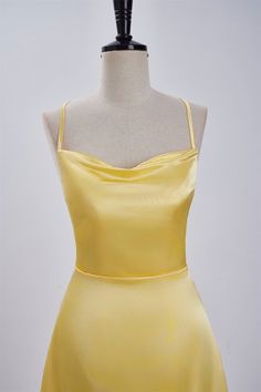 Expertly crafted from satin fabric, this stunning A-line dress boasts a striking cowl neck and delicate spaghetti straps. The back features a lace-up design, while the above knee length adds a touch of elegance to the overall silhouette. Available in a vibrant yellow hue, this dress is sure to make a statement. Item #NP1113 Material: Satin Color: Yellow Silhouette: A-line Embellishment: Cowl neck Neck: Spaghetti straps Back: Lace-up Length: Above knee length Fully lined: Yes Built-in bra: Yes True to size. Made in China. Dresses are usually packed inside out for protection. Hand wash Sleeveless Satin Dress With Boning, Satin Spaghetti Strap Dinner Dress, Dinner Satin Dress With Spaghetti Straps, Backless Satin Slip Dress With Boning, Satin Mini Dress With Spaghetti Straps For Dinner, Satin Bridesmaid Dress With Spaghetti Straps, Satin Camisole Party Dress, Satin Finish Camisole Dress For Evening, Evening Camisole Dress With Satin Finish