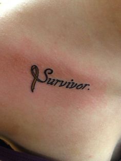 a woman's stomach with the word survivor written on her side and an orange ribbon