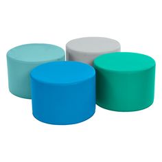 three different colored stools sitting next to each other