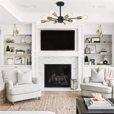 a living room filled with furniture and a flat screen tv mounted on the wall above a fire place