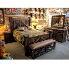 a bed room with a neatly made bed and wooden walls