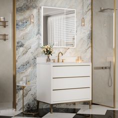 a bathroom with marble walls and flooring