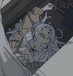 an anime character sitting in the driver's seat of a car with her hand up