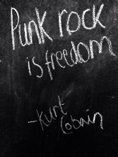 a blackboard with writing on it that says punk rock is freedom