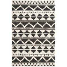 a black and white rug with geometric designs