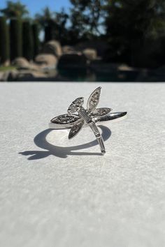 "A timeless and classic design, symbolizing strength and everlasting love. Perfect for everyday wear or dressed up for special occasions. Make a bold statement in our Genuine Diamond Dragonfly Ring, handcrafted in 14k white gold.  Item Specifications: Materials: 14k White Gold  Gemstone: Natural Diamond Dragonfly Diameter: 11.6mm x 11.6mm Total Gold Weight: 1.69 ct. Total Diamond Carat Weight: 0.10 ct. Diamond Clarity: SI 1-2 Diamond Color: G-H color ★  Each order will be beautifully packaged in a jewelry box and comes with a drawstring pouch that's perfect for travel. LiebeJewelry's products are handcrafted and all materials are genuine and ethically sourced. If you have any additional questions about this ring, just hit the \"Ask a Question\" button (just to the right of the price) and w Adjustable White Gold Rings With Vvs Clarity, Adjustable White Gold Ring With Vvs Clarity, Silver 14k Gold Open Diamond Ring, Silver Open Diamond Ring In 14k Gold, 14k White Gold Open Ring With Brilliant Cut, Adjustable White Gold Butterfly Ring, Sterling Silver Diamond Cut Open Ring, Silver Butterfly Ring With Brilliant Cut For Anniversary, Silver Diamond Butterfly Ring With Brilliant Cut