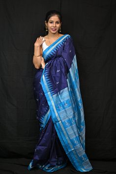 Exclusive hand-woven Bomkai silk saree with birds pattern. This is a double Ikkat saree from Odisha handloom. Finest pure handwoven sambalpuri ikat silk saree with traditional motifs woven by the master weavers of Sambalpur, Odisha. It has lovely patterns and is world-famous for its stunning colours, texture and designs. Specification:  Occasion: Festive Wear Fabric: Bomkai silk, silk Primary Color: Neavy Blue Secondary Color: Blue Material : Silk Pattern: Motif Border Type: Ikkat Border Size: Medium Blouse Piece: Included Care: Dry Clean Disclaimer : This is a genuine handwoven piece, & that could expect unevenness in the selvedge and weave, and colours may fade or bleed due to the traditional dyeing method employed. Saree's fall & edging will be done complimentary for all international o Bomkai Silk Sarees, Blue Silk Traditional Wear With Woven Motifs, Traditional Blue Saree With Weaving Work, Blue Tussar Silk Pre-draped Saree With Traditional Patterns, Blue Art Silk Saree With Weaving Work, Blue Katan Silk Traditional Wear With Weaving Work, Blue Tussar Silk Traditional Wear With Weaving Work, Traditional Blue Saree With Woven Motifs, Blue Traditional Wear With Weaving Work In Art Silk