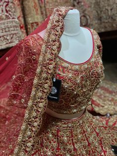 Traditionally royal red intricately embroidered lehenga with gold zardosi, thread, sequins, pearl and rhinestone teamed up with matching embroidered blouse and net dupatta. Never fail to impress with this stunning lehenga hued in red mesmerizes you with its rich elegance. Fabric: Raw Silk Custom designed according to client measurements and color preference. Production and delivery time is 120 days! Party Wear Embroidered Lehenga In Raw Silk, Party Wear Raw Silk Choli With Intricate Embroidery, Party Choli With Intricate Kundan Embroidery, Elegant Silk Thread Choli For Eid, Party Wear Sets With Intricate Embroidery For Festivals, Designer Silk Thread Lehenga For Festivals, Party Wear Sharara With Intricate Embroidery For Festivals, Red Party Wear Lehenga With Intricate Embroidery, Party Wear Gold Lehenga With Intricate Embroidery