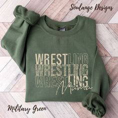 a green sweatshirt with the words wrestling on it