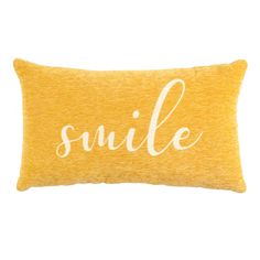 a yellow pillow with the word smile on it