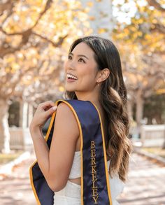 a woman wearing a blue and yellow backpack with the words brooklyn printed on it in gold