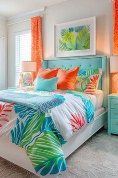 a bedroom with bright colored bedding and tropical prints on the comforter, pillows, and lamps