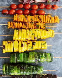 several skewers filled with different types of vegetables