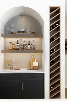 a wine rack in the corner of a kitchen